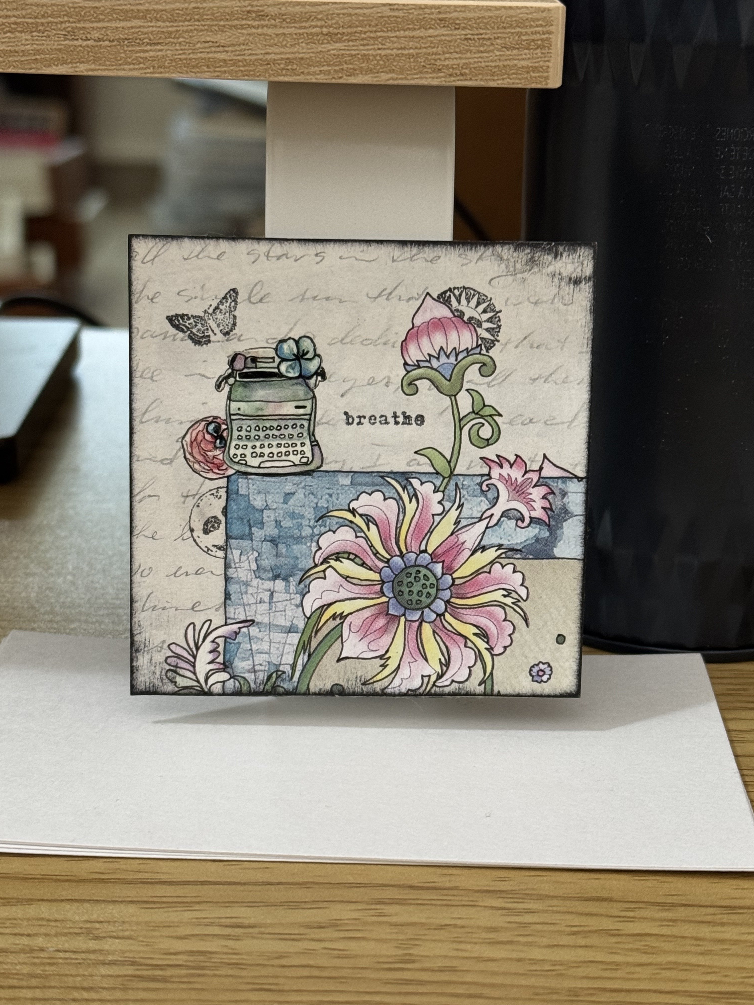 A 3” x 3” mixed media…